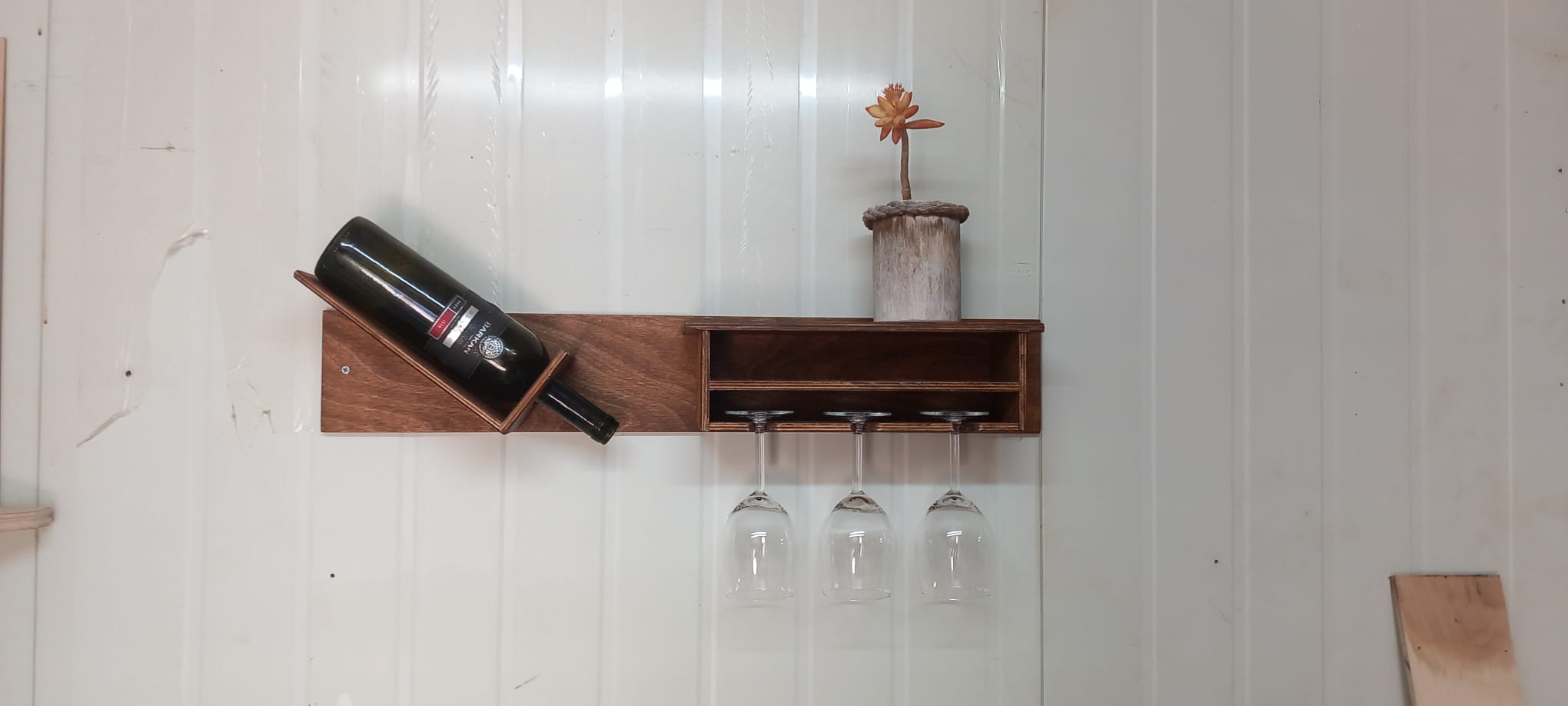 Handcrafted wooden wine rack with glass holder
